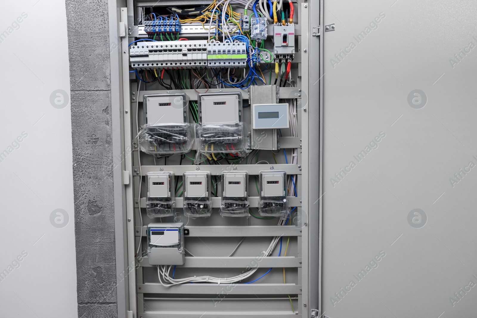 Photo of Fuse box with many electric meters and wires