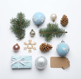 Composition with Christmas decorations on white background, top view. Winter season