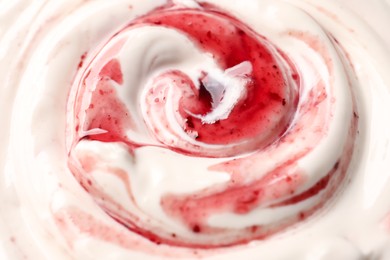 Photo of Tasty yoghurt with jam as background, closeup