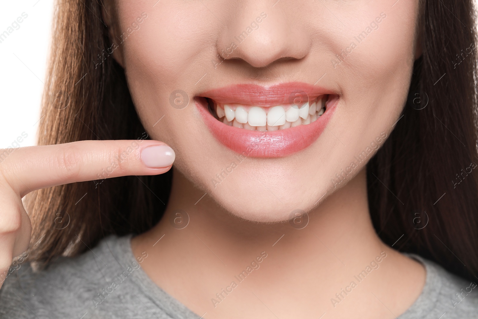 Photo of Woman showing healthy gums on white background, closeup