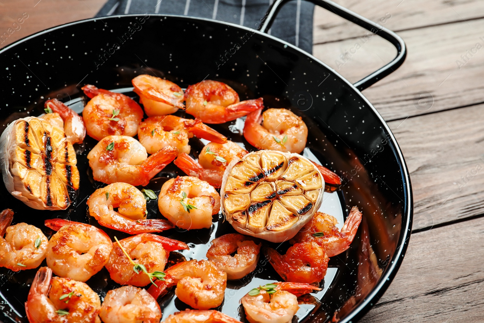 Photo of Delicious fried shrimps with garlic in frying pan, closeup