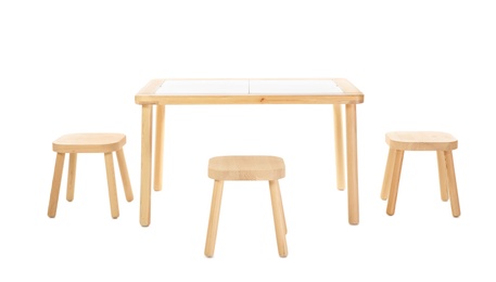 Wooden table and stools for kids isolated on white