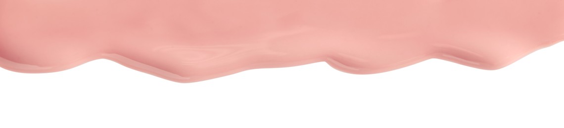 Photo of Light pink nail polish flowing on white background