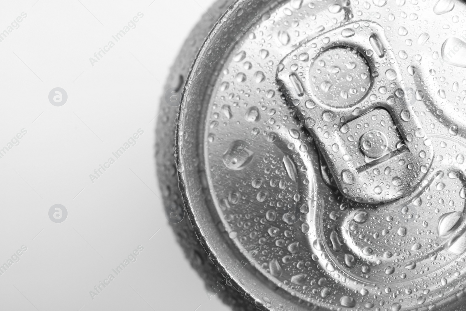 Photo of Wet closed can on white background, closeup