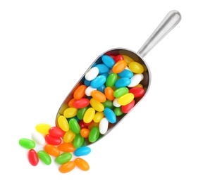 Photo of Scoop of tasty jelly beans on white background, top view