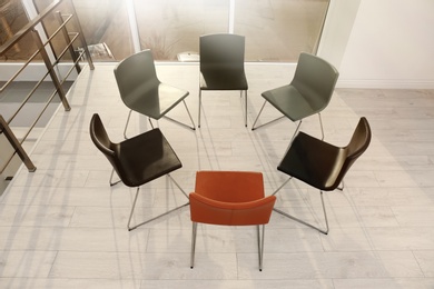 Chairs prepared for group therapy session in office. Meeting room interior