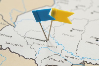 Photo of MYKOLAIV, UKRAINE - NOVEMBER 09, 2020: Ivano-Frankivsk city marked with push pins on contour map of Ukraine, closeup