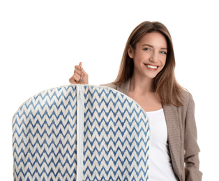 Photo of Young woman holding garment cover with clothes on white background. Dry-cleaning service