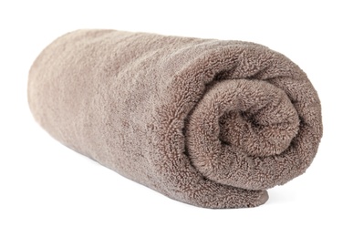 Rolled clean brown towel on white background