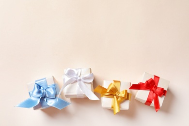 Photo of Beautiful gift boxes on light background, top view