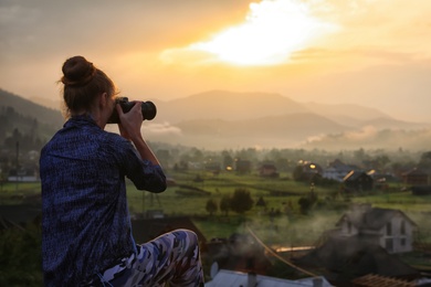 Photo of Professional nature photographer taking photos in mountains