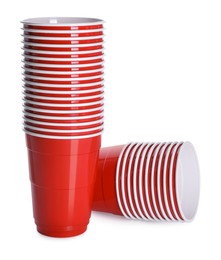Many red plastic cups on white background