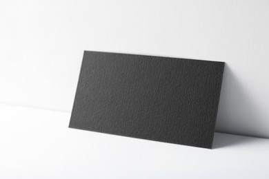 Photo of Blank black business card on white background. Mockup for design
