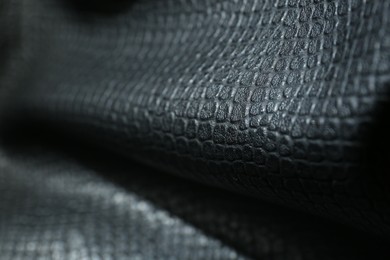 Photo of Black natural leather as background, closeup view