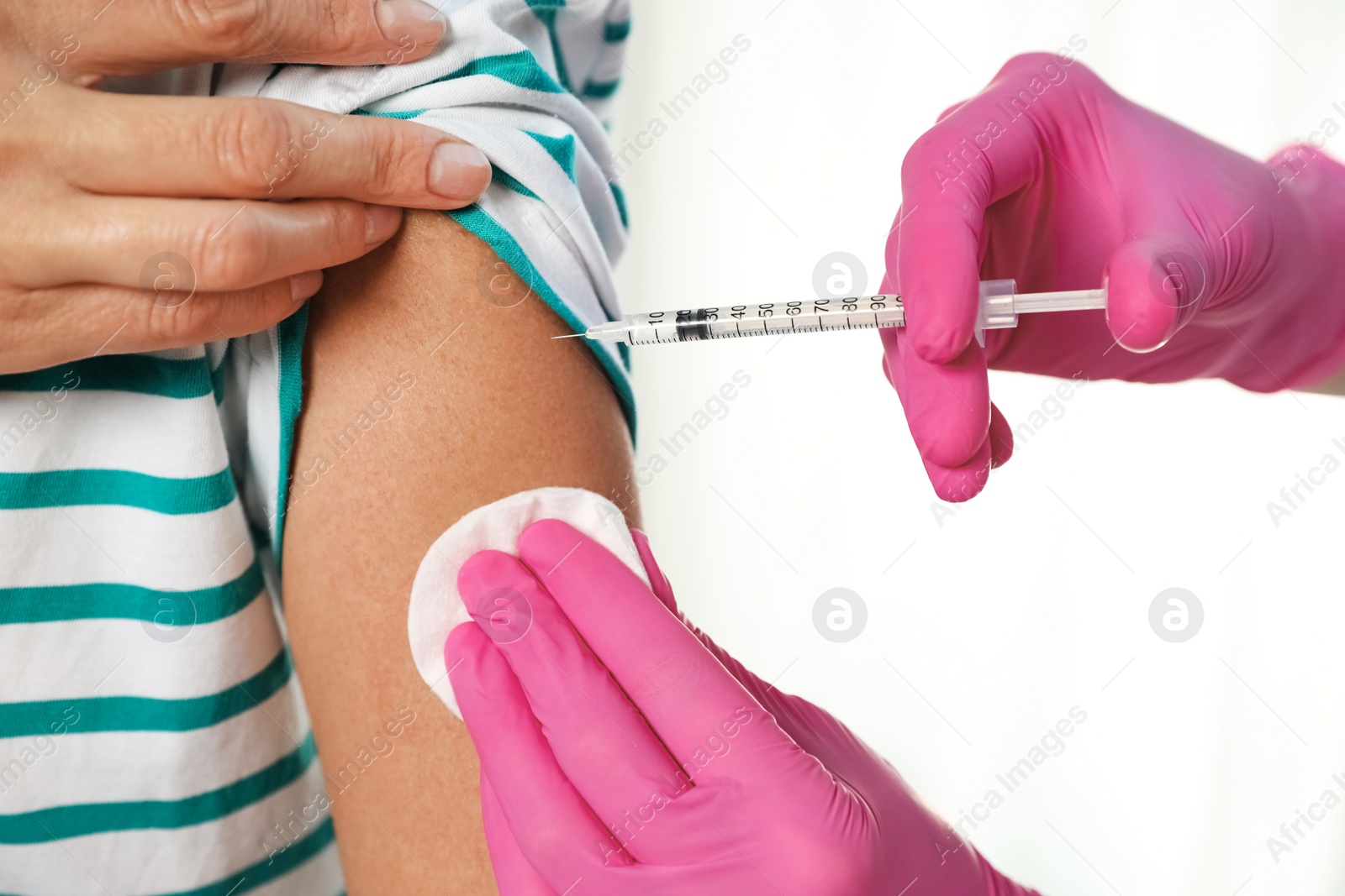 Photo of Doctor giving injection to patient in hospital, closeup. Vaccination day