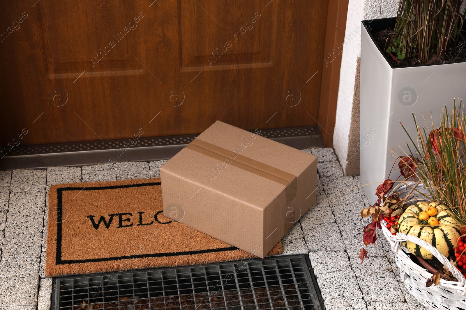 Photo of Parcel delivered on mat near front door