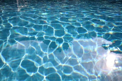 Clear water in outdoor swimming pool on sunny day