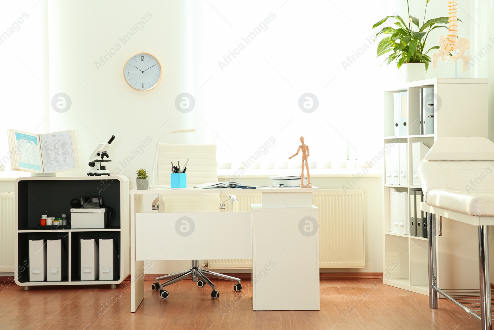 Photo of Interior of modern medical office. Doctor's workplace