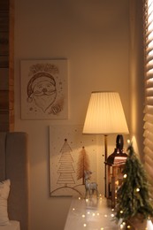 Beautiful Christmas pictures in decorated room. Interior design