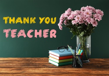 Image of Set of stationery and flowers on wooden table near chalkboard with phrase Thank You Teacher