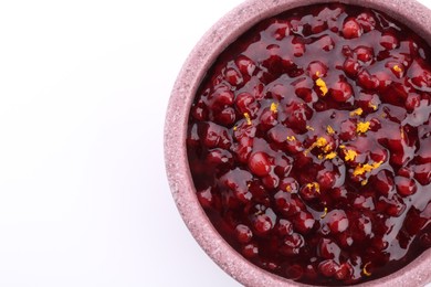 Tasty cranberry sauce in bowl isolated on white, top view