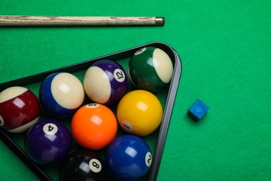Photo of Flat lay composition with balls and cue on billiard table