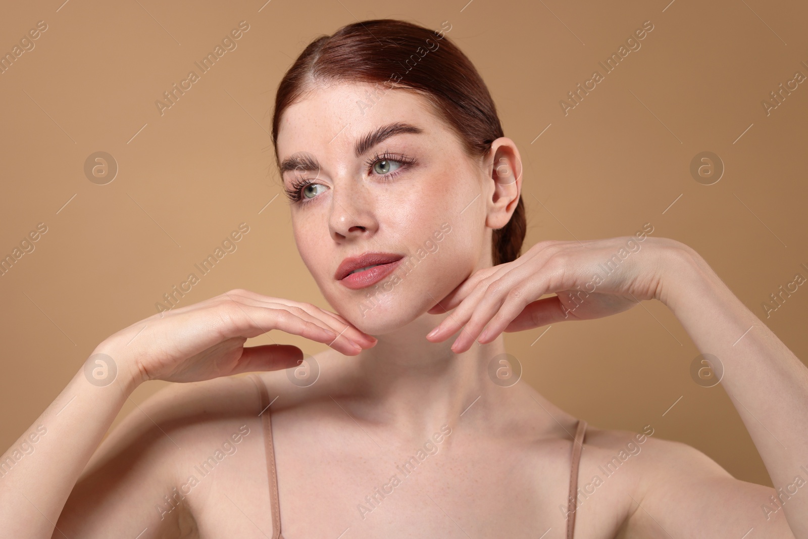 Photo of Portrait of beautiful woman on beige background, closeup