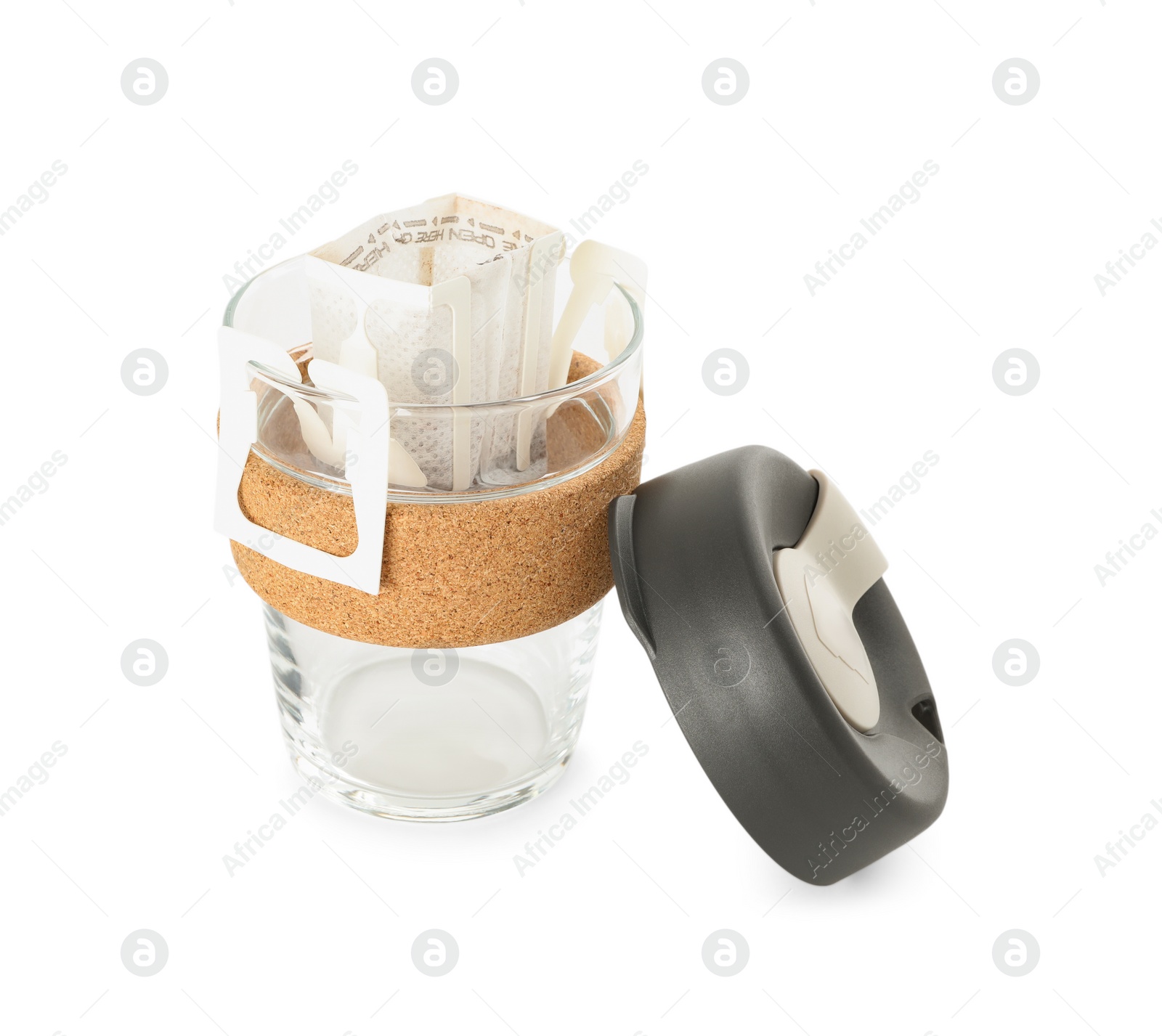 Photo of Glass cup with drip coffee bag isolated on white