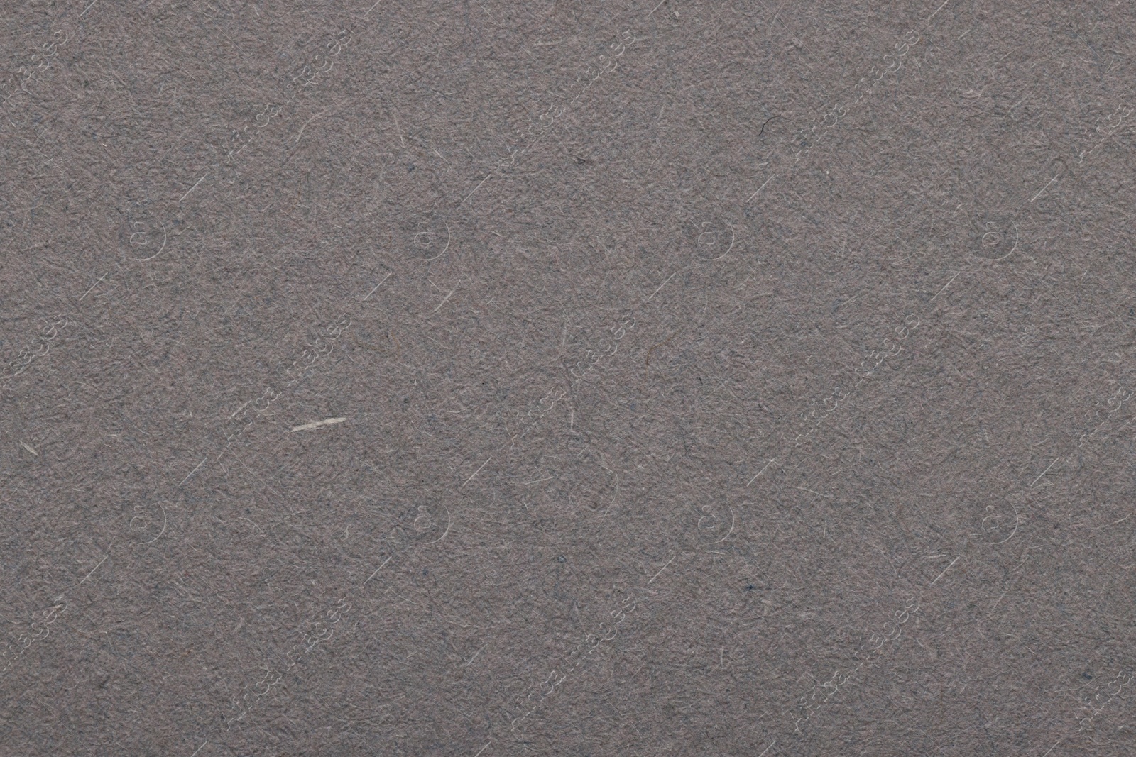 Photo of Texture of grey paper sheet as background, top view