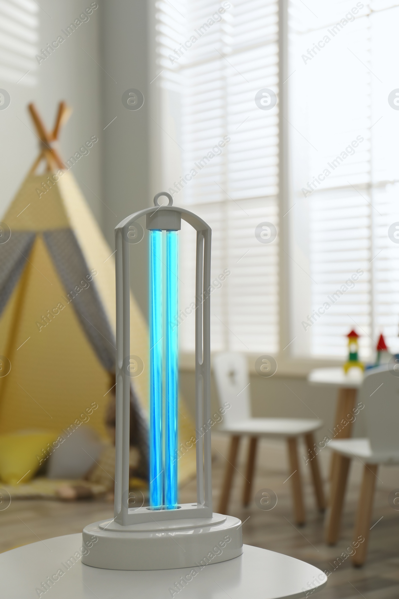 Photo of UV sterilizer lamp on table at home