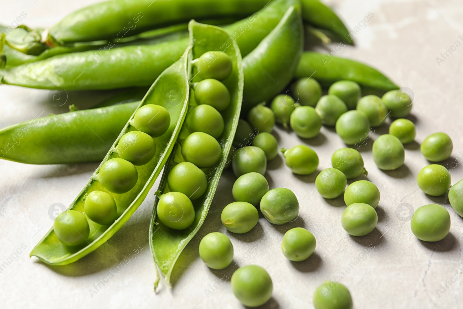 Photo of Fresh green peas on light background, closeup