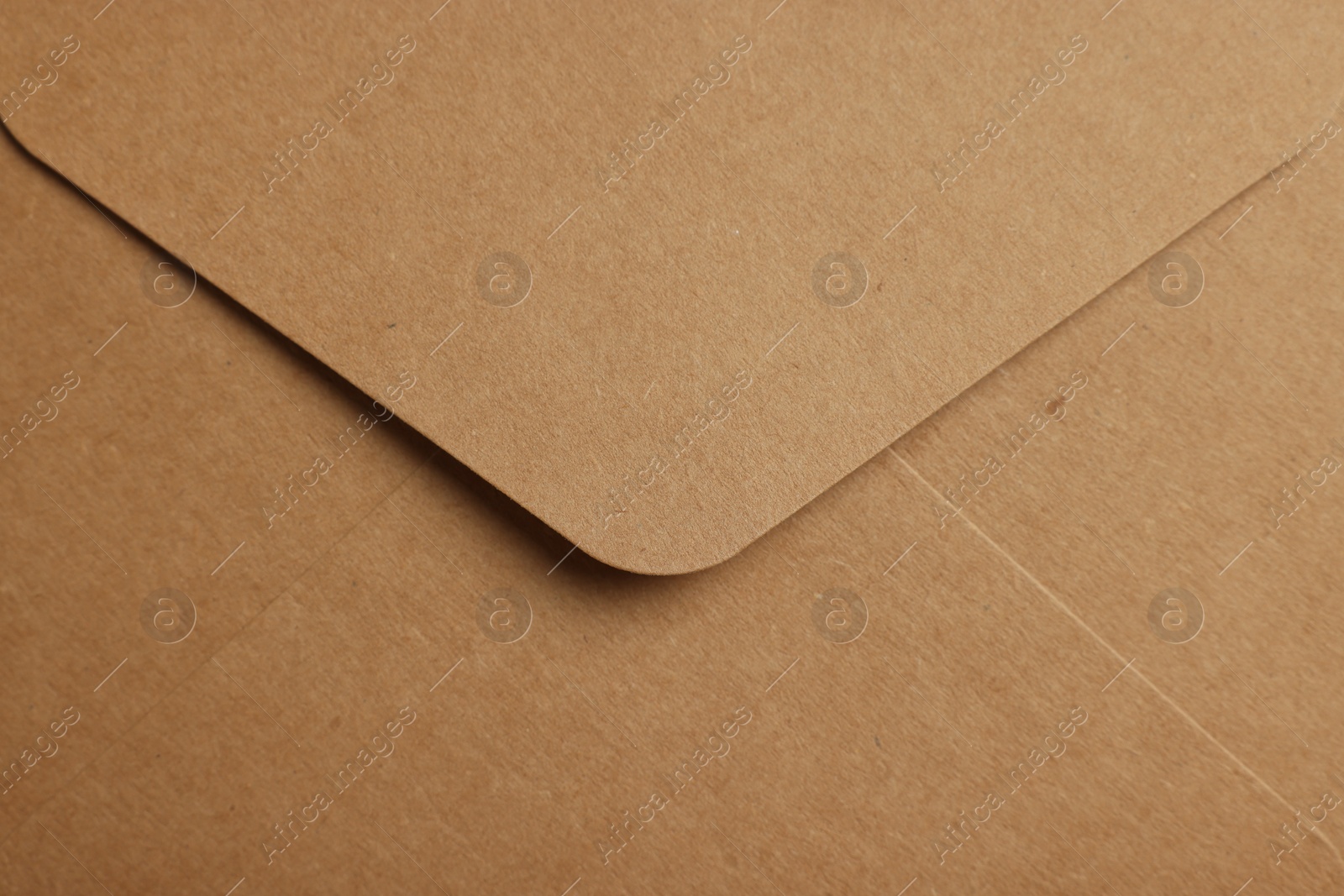 Photo of Envelope made of parchment paper as background, top view