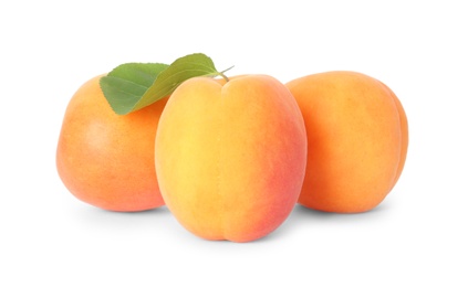 Photo of Delicious ripe sweet apricots isolated on white