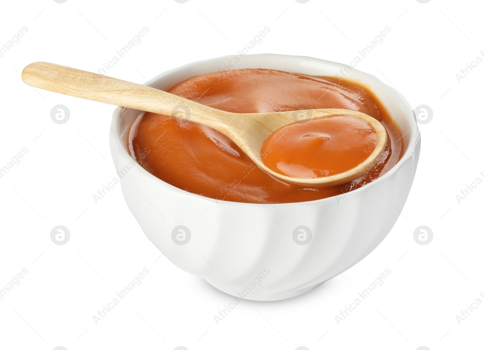 Photo of Delicious persimmon jam and spoon in bowl isolated on white