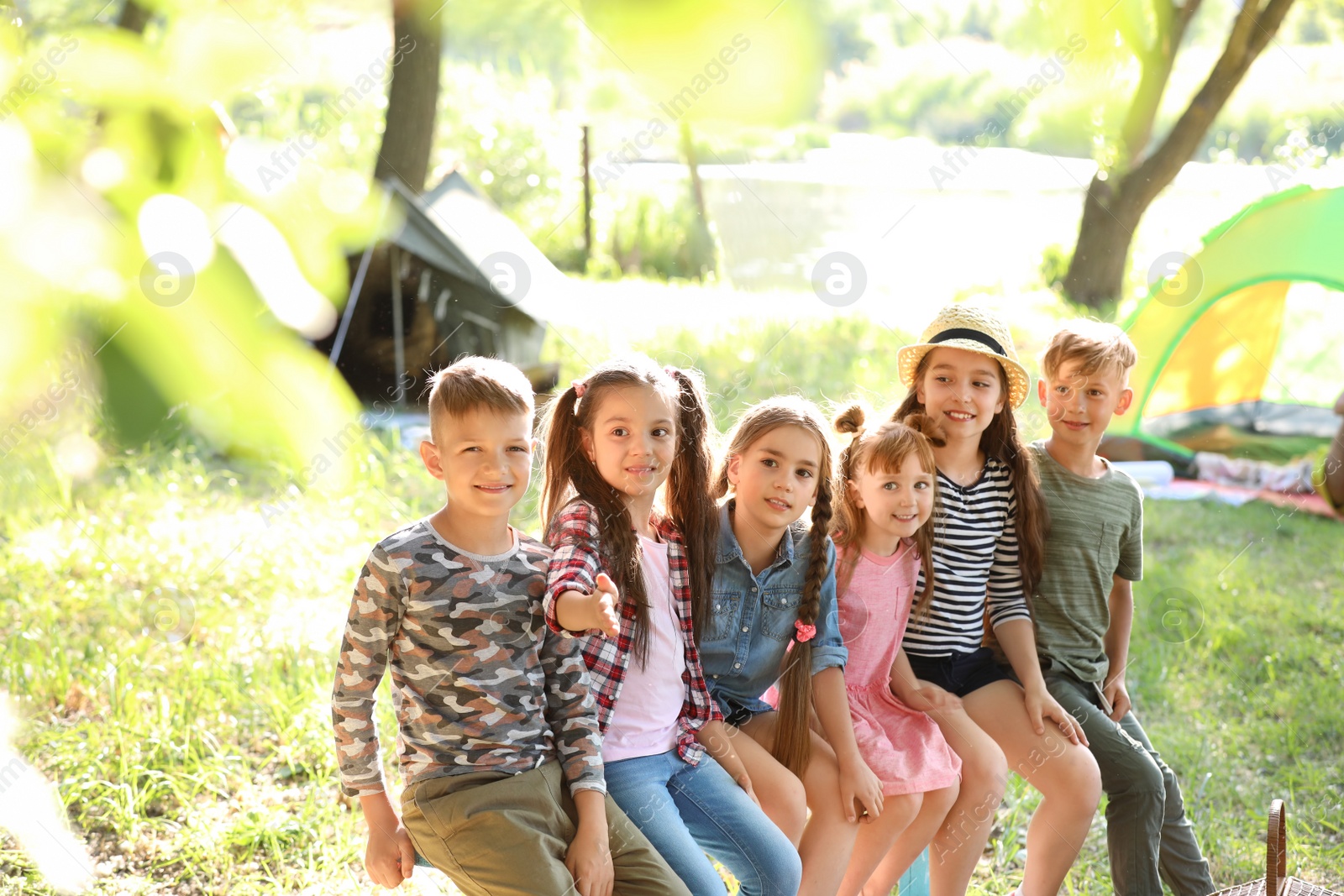 Photo of Little children outdoors on sunny day. Summer camp