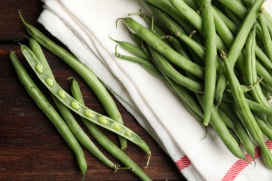 Photo of Fresh green beans on wooden table, flat lay