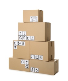 Stack of cardboard boxes with different packaging symbols on white background. Parcel delivery