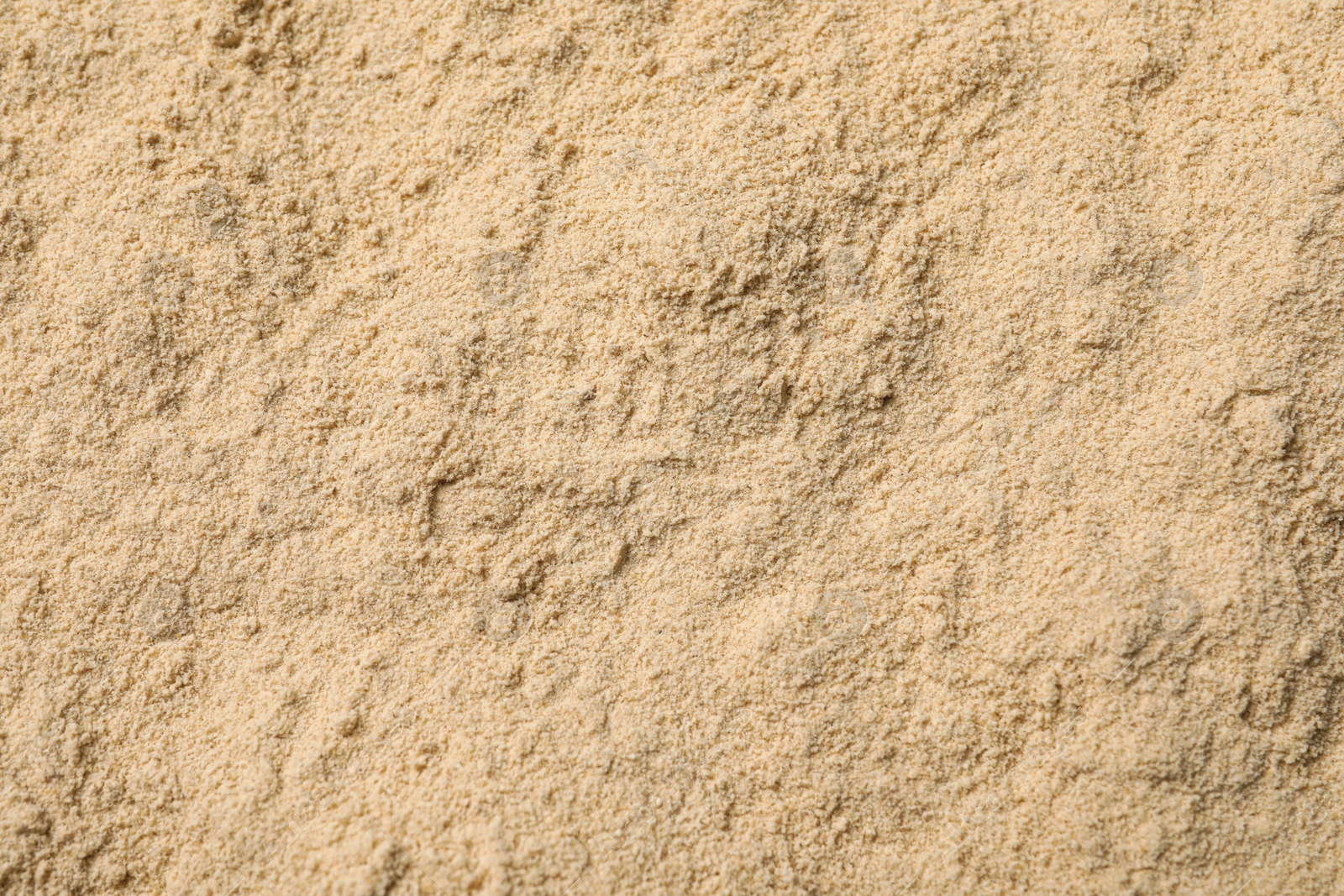 Photo of Heap of buckwheat flour as background, top view