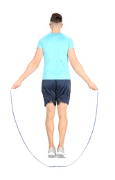 Sportive man training with jump rope on white background