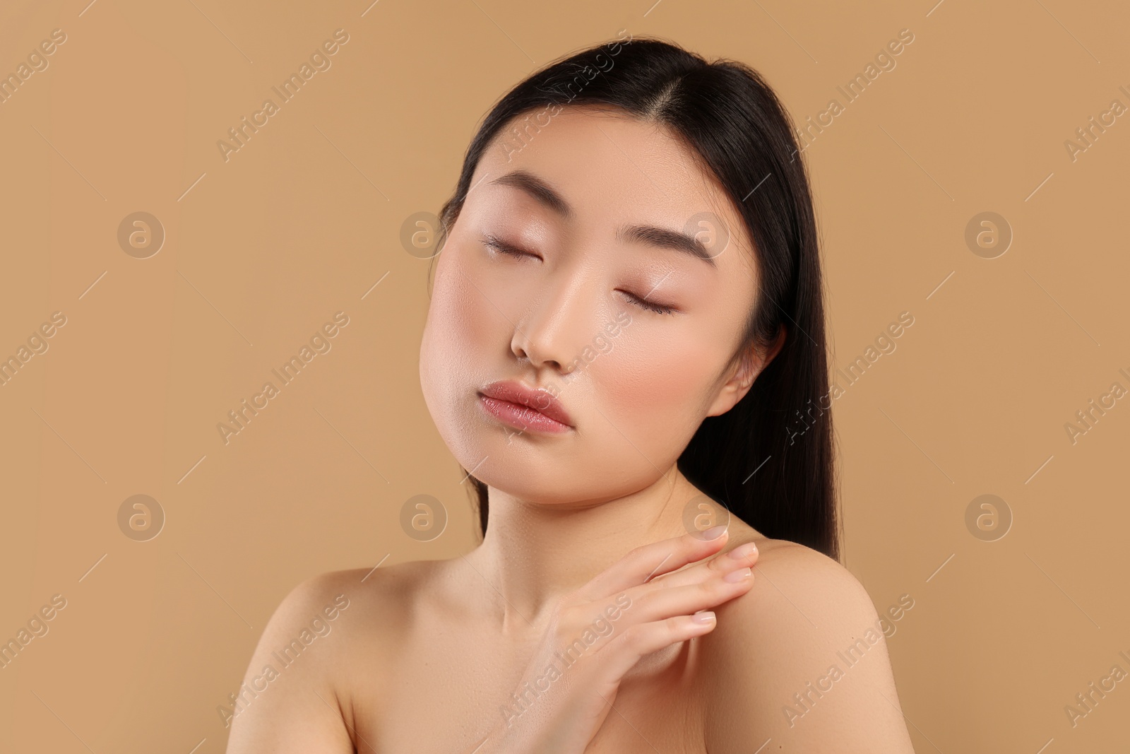 Photo of Beautiful woman with healthy skin on beige background