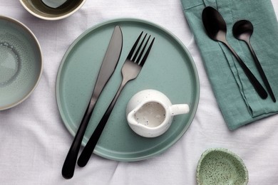 Photo of Stylish empty dishware and cutlery on table, flat lay