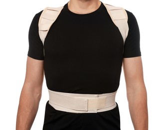 Closeup view of man with orthopedic corset on white background