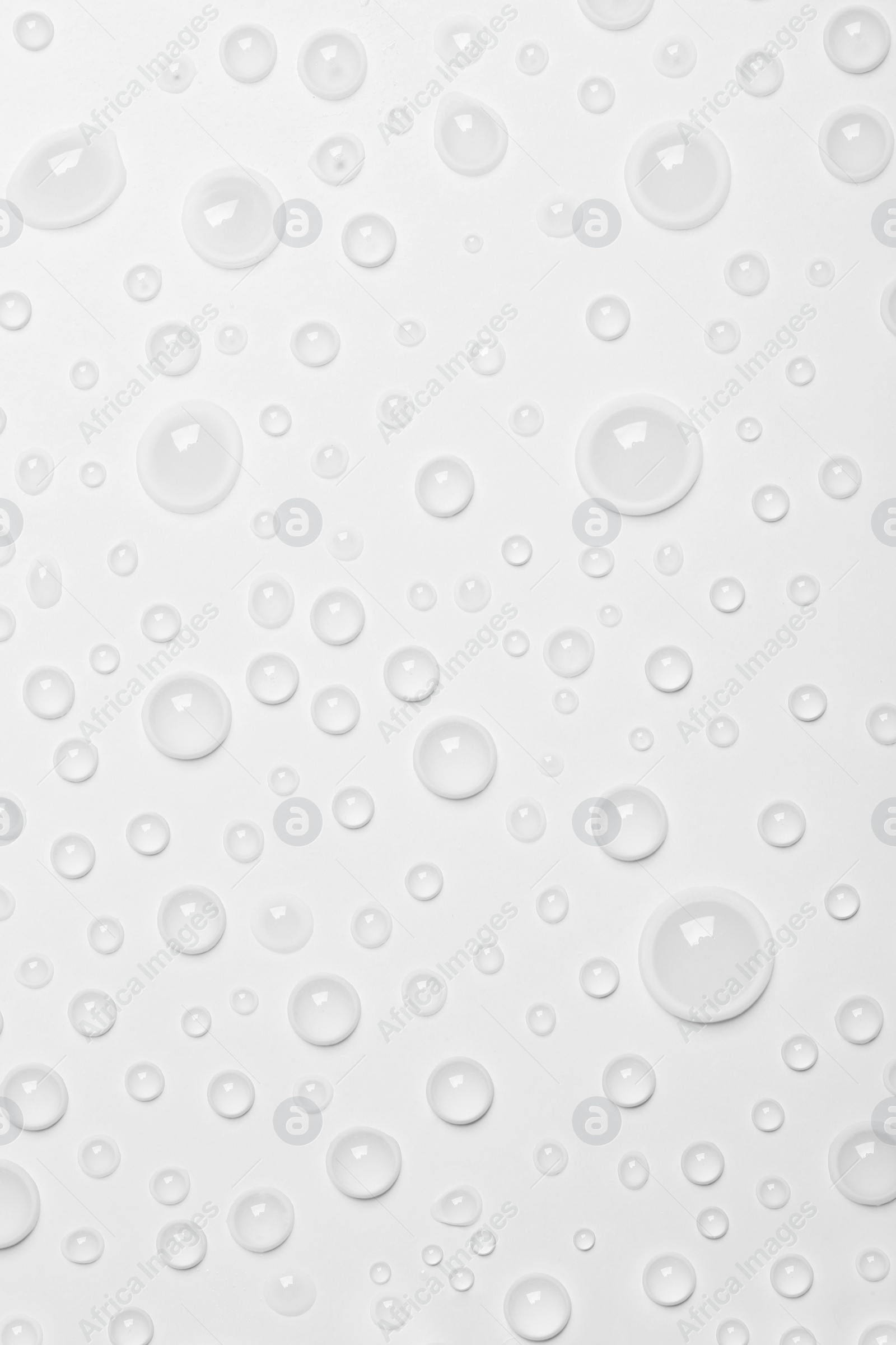 Photo of Water drops on white background, top view