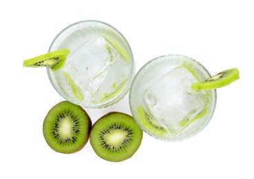 Photo of Refreshing drink and cut kiwi isolated on white, top view