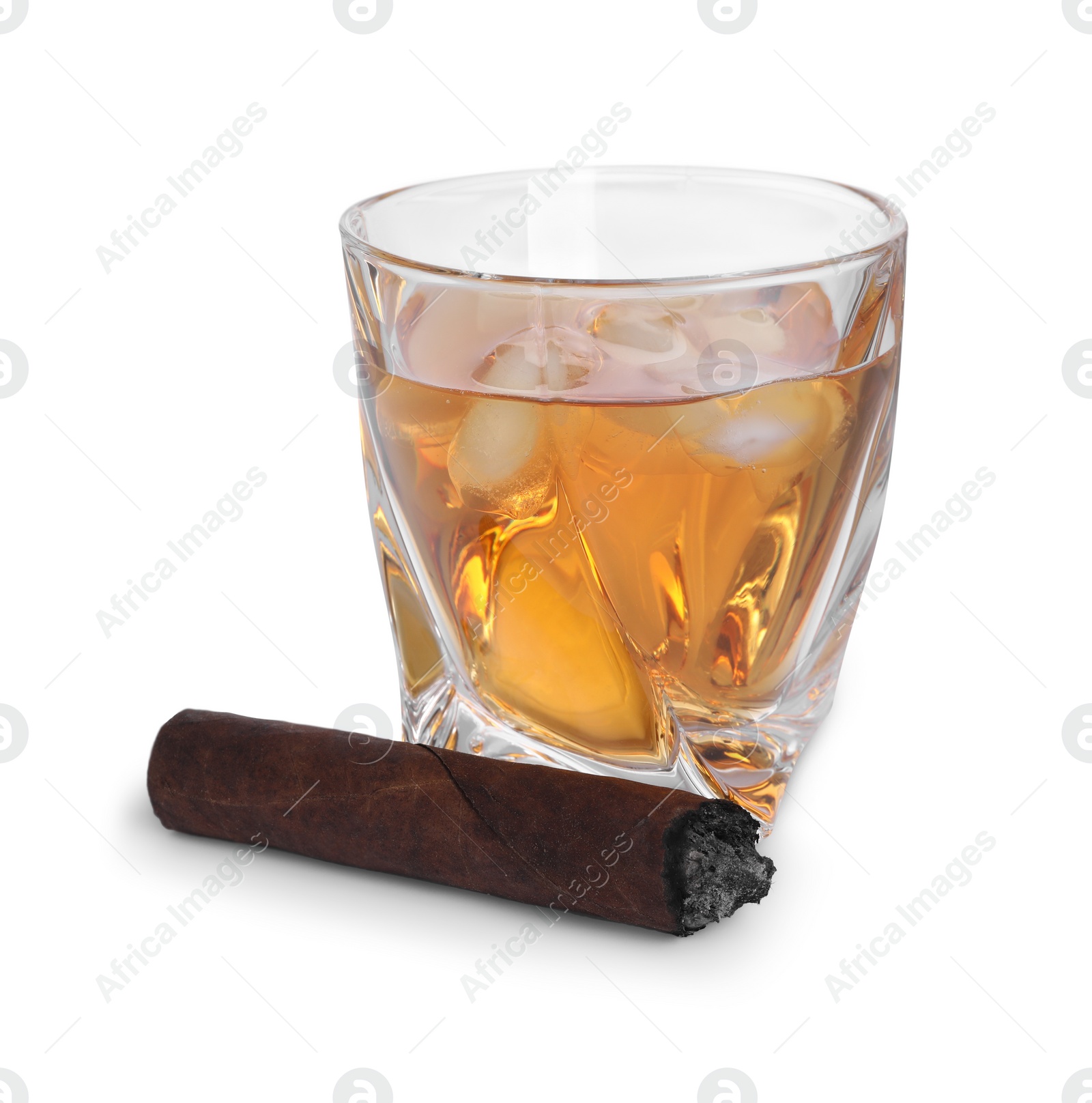 Photo of Glass of whiskey and burnt cigar isolated on white