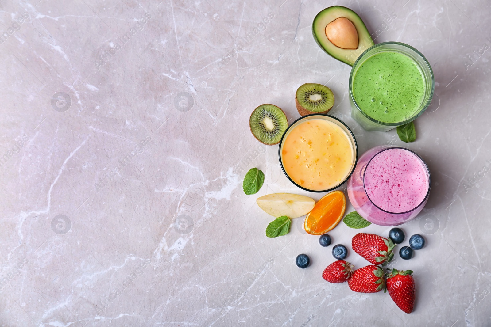 Photo of Flat lay composition with healthy detox smoothies and ingredients on light background