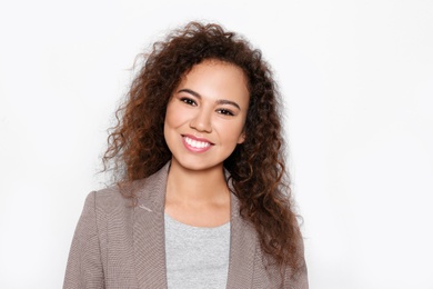 Photo of Young African-American woman with beautiful face on white background