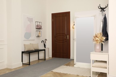 Photo of Modern hallway interior with stylish furniture and mirror