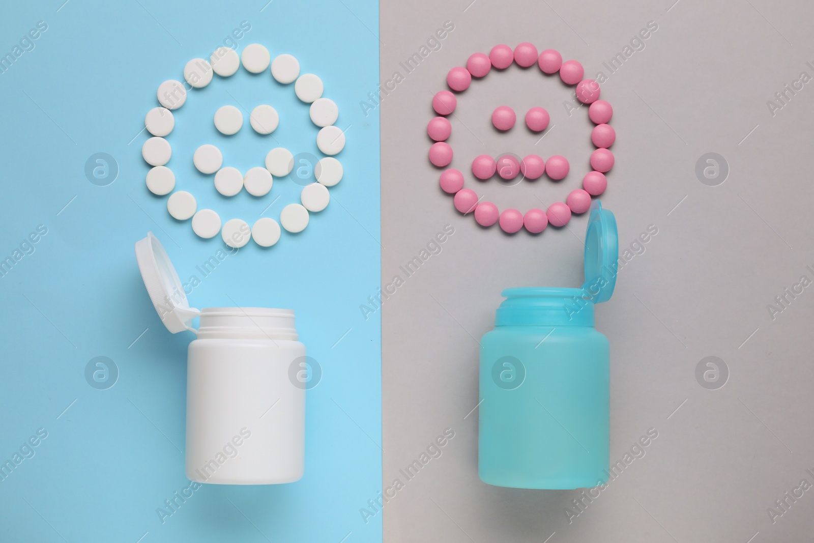 Photo of Different emoticons made of antidepressants and medical jars on color background, flat lay