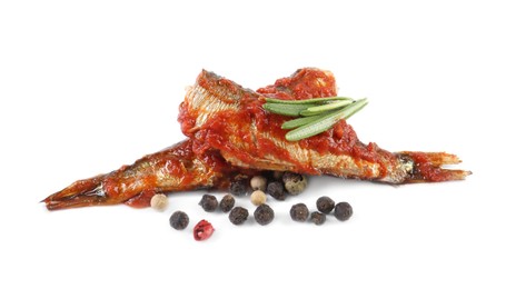 Photo of Tasty canned sprats with tomato sauce, rosemary and peppercorns isolated on white